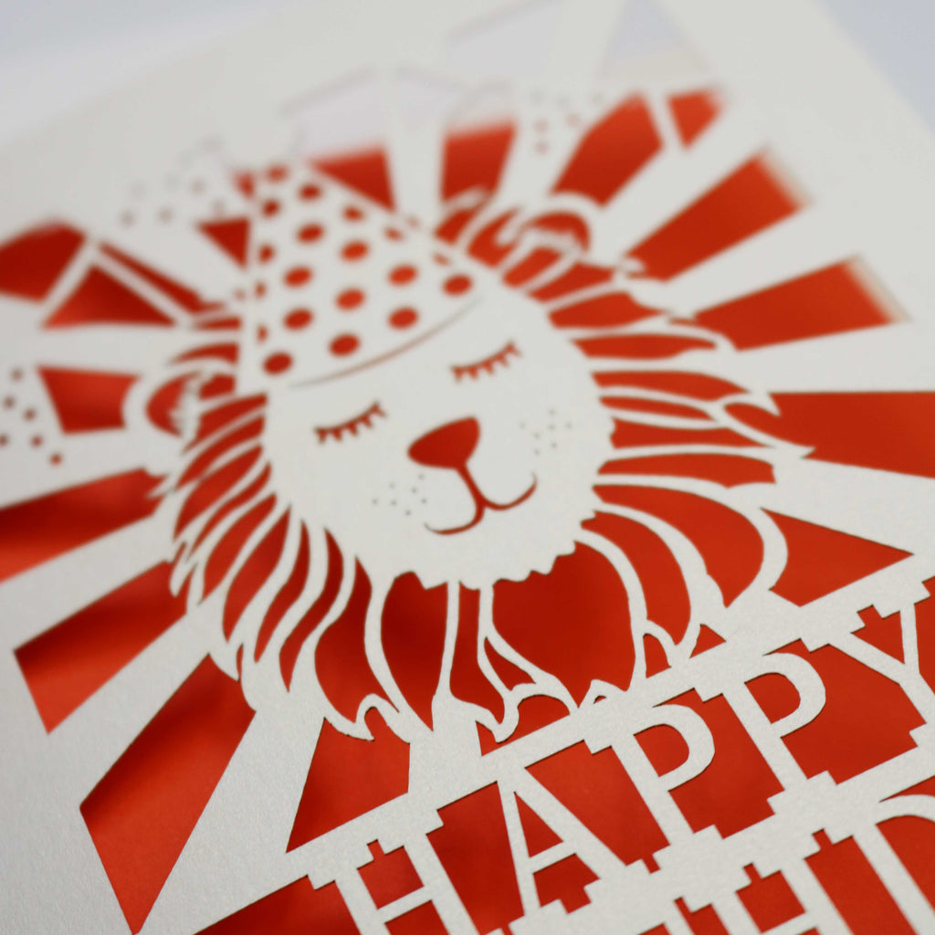 Close up detail of a laser cut lion birthday card