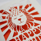 Close up detail of a laser cut lion birthday card
