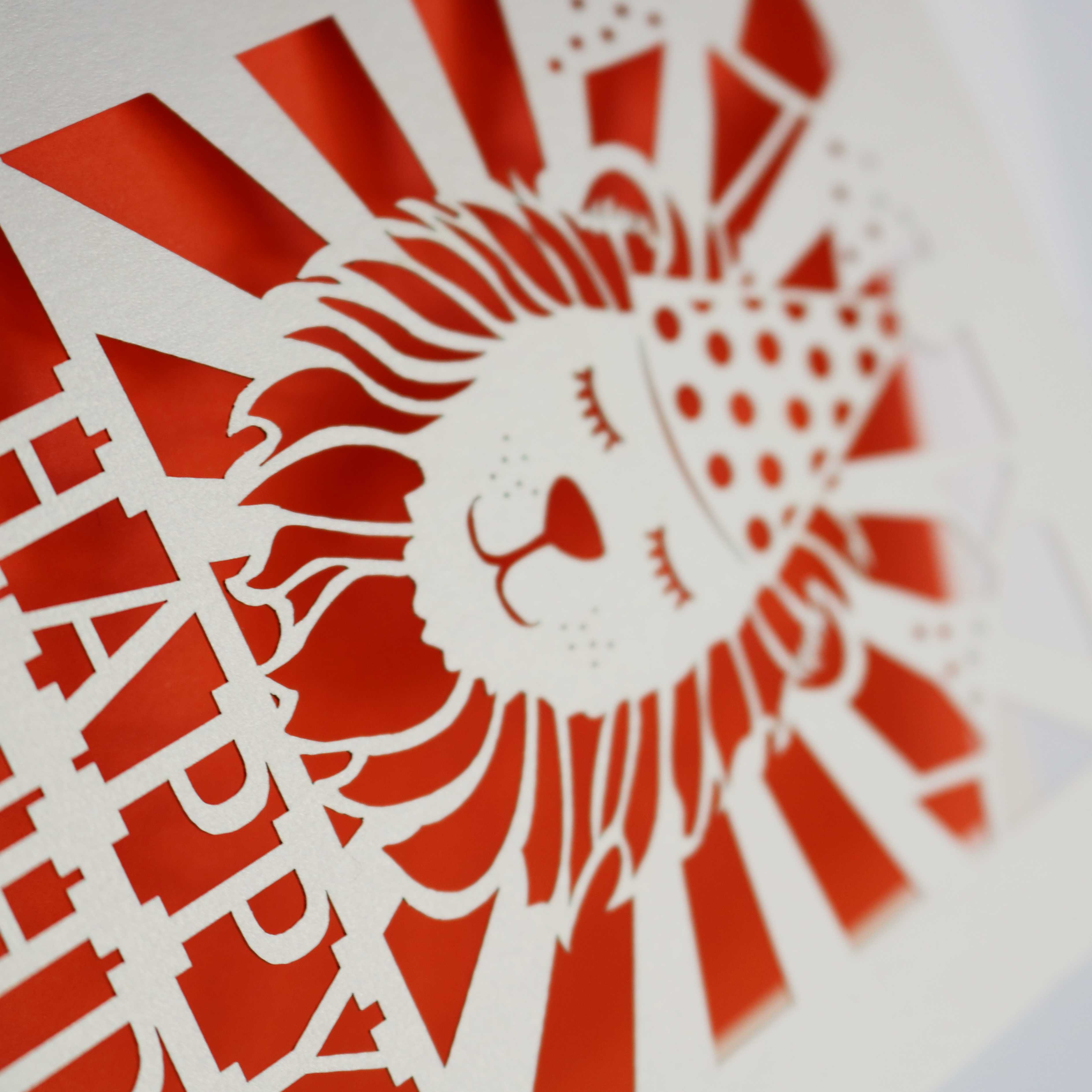 Close up detail of a laser cut lion birthday card