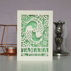 A personalised birthday card with a papercut design featuring the Pisces constellation and a fish symbol.