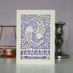 A personalised birthday card with a papercut design featuring the Pisces constellation and a fish symbol.