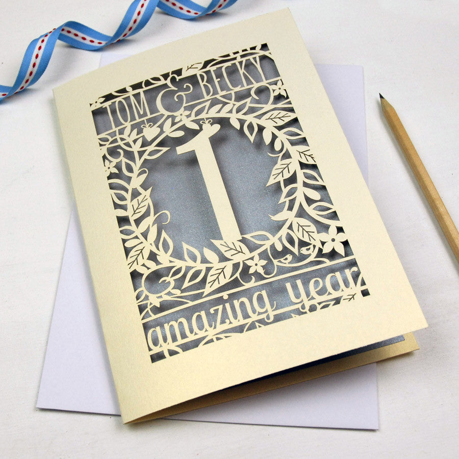 A cream and silver anniversary card. Laser cut and personalised with the names and number of amazing years.