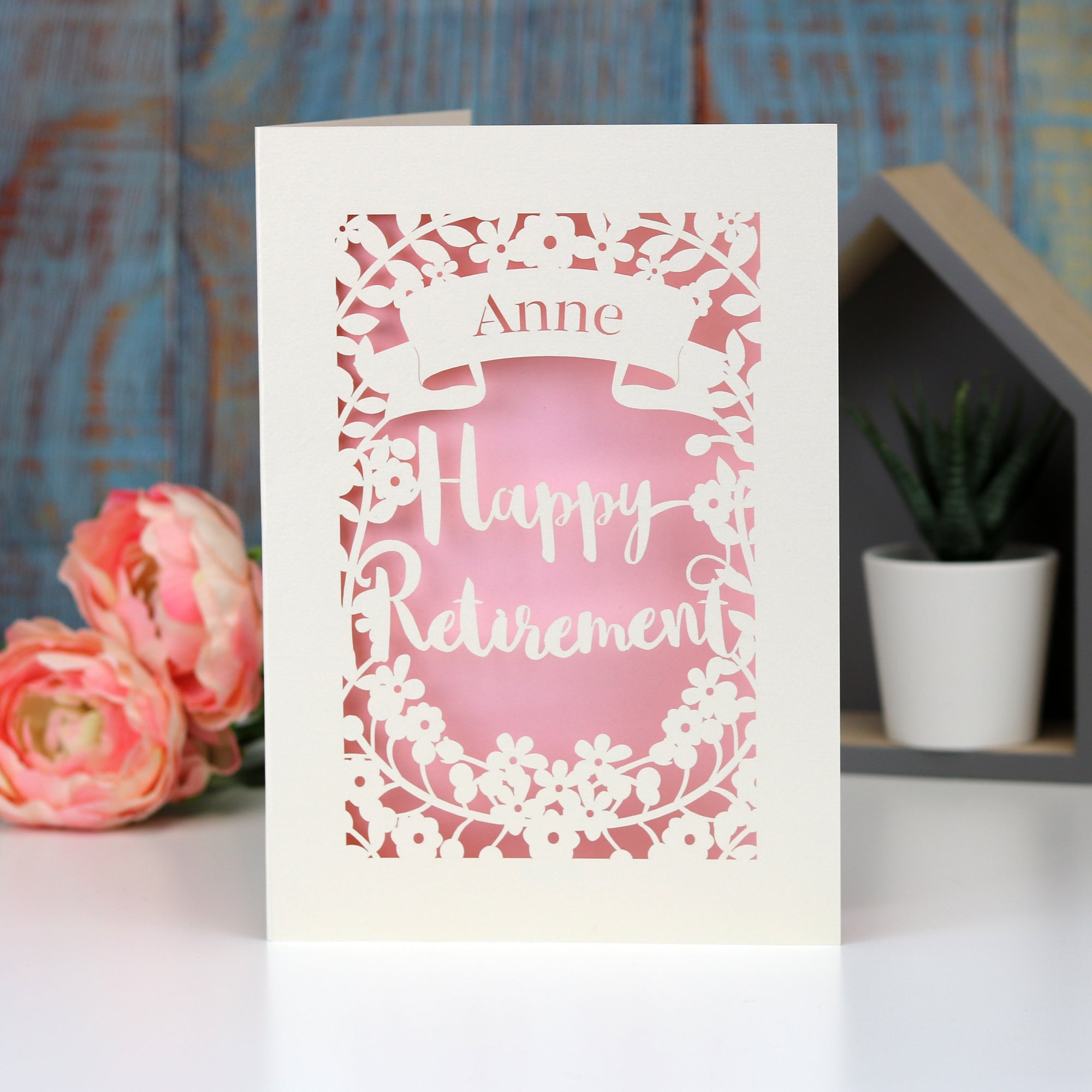 Happy Retirement personalised papercut card. Cut from cream card and finished off with a pale pink insert paper.
