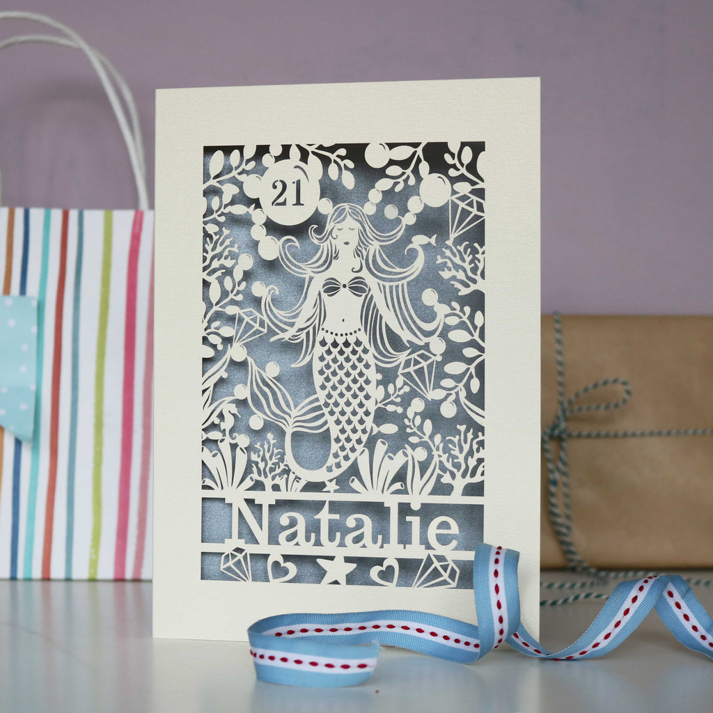 A cream and silver mermaid laser cut birthday card for girls.