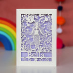 A birthday card for girls. Laser cut mermaid with a lilac background, name and age.