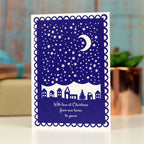 Navy blue and white Christmas card with the words "With love at Christmas from our home to yours"