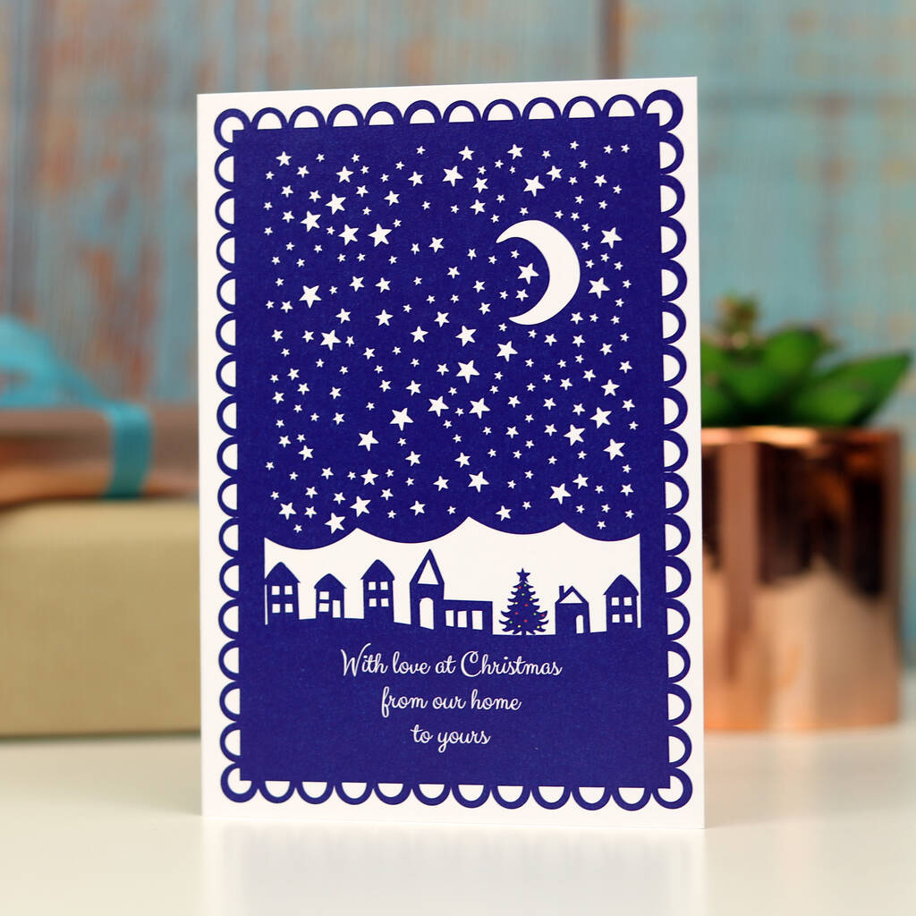 Navy blue and white Christmas card with the words "With love at Christmas from our home to yours"