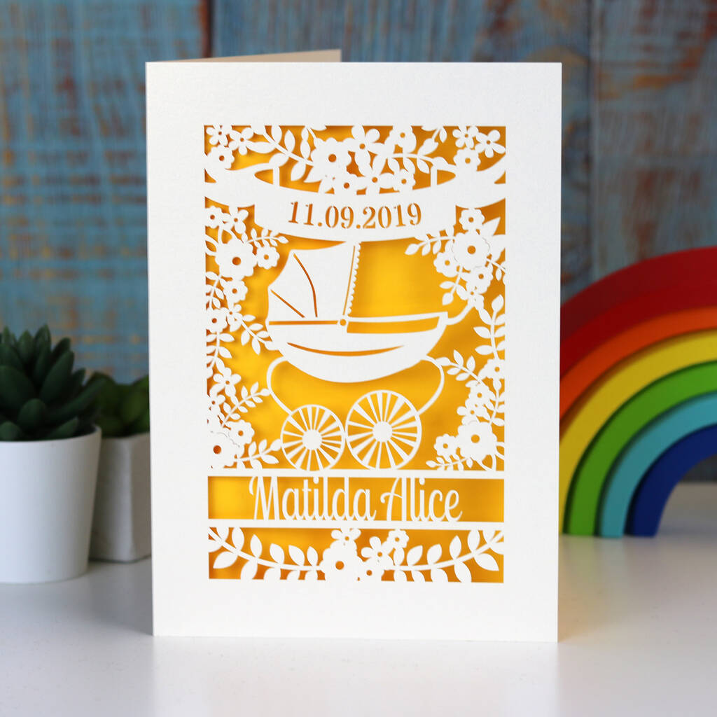 A cream and yellow gender neutral new baby card personalised with a name and date.