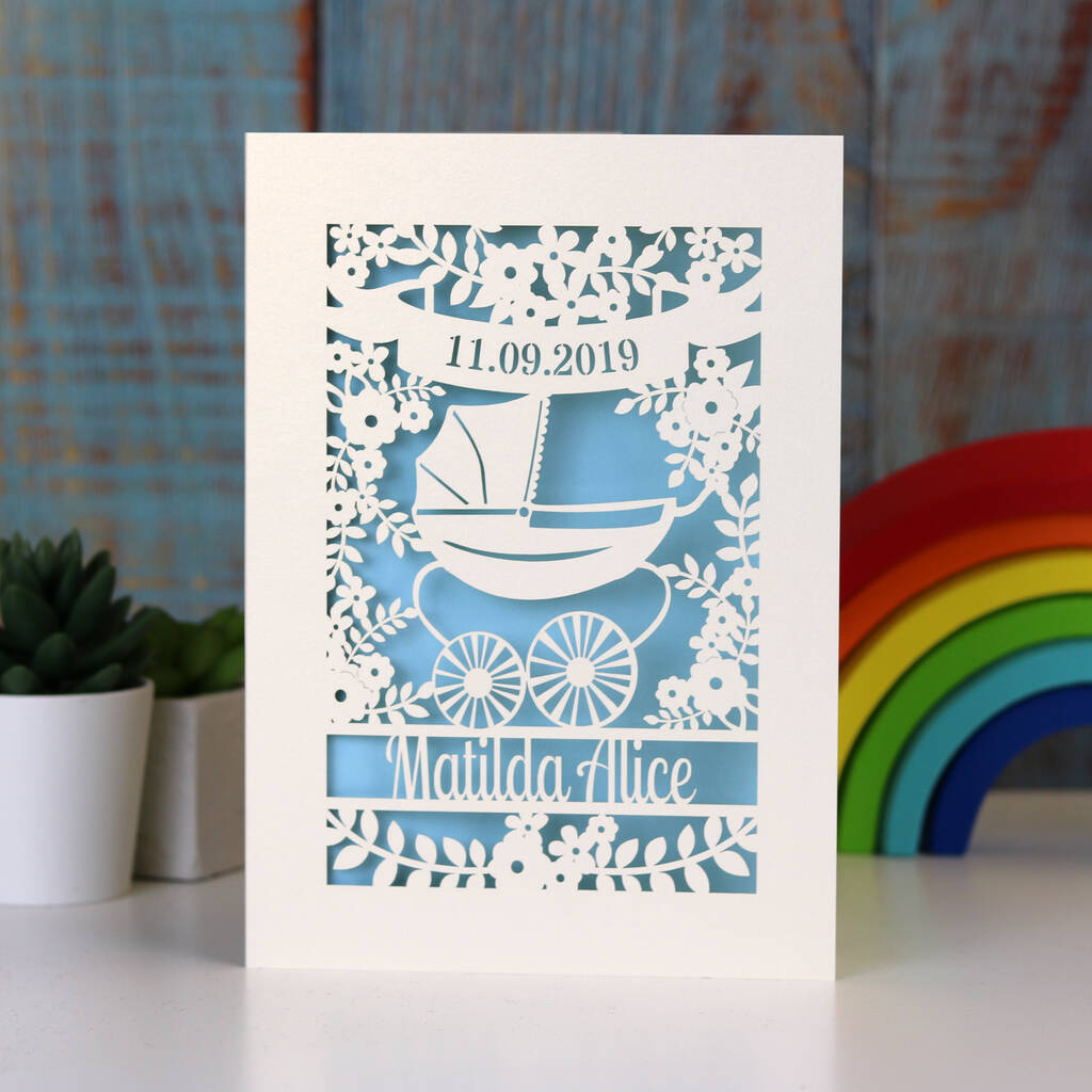 Papercut new baby cards, personalised with name and date of birth. Design is a Silvercross pram and flowers. 