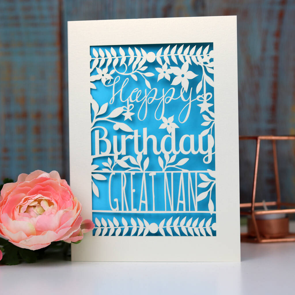 A paper cut birthday card personalised with a name.