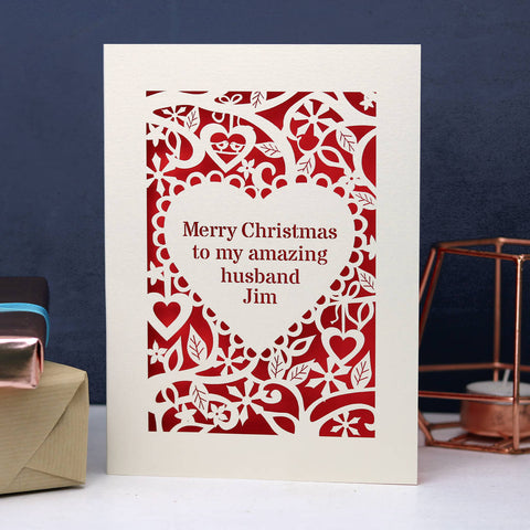 A cream and red personalised card for Christmas. Card has text inside a heart shape, with a border of hearts, flowers and snowflakes. - A5 / Cream / Bright Red
