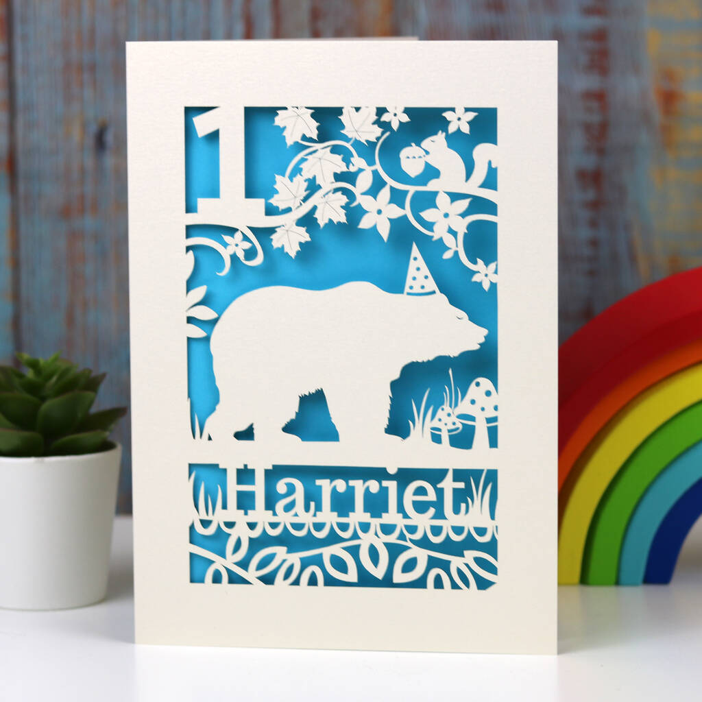 Bear birthday card laser cut from cream card with a peacock blue insert paper.  Personalise with a name and age.