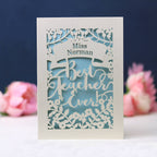 A cream and light blue paper cut thank you teacher card, personalised with teacher's name