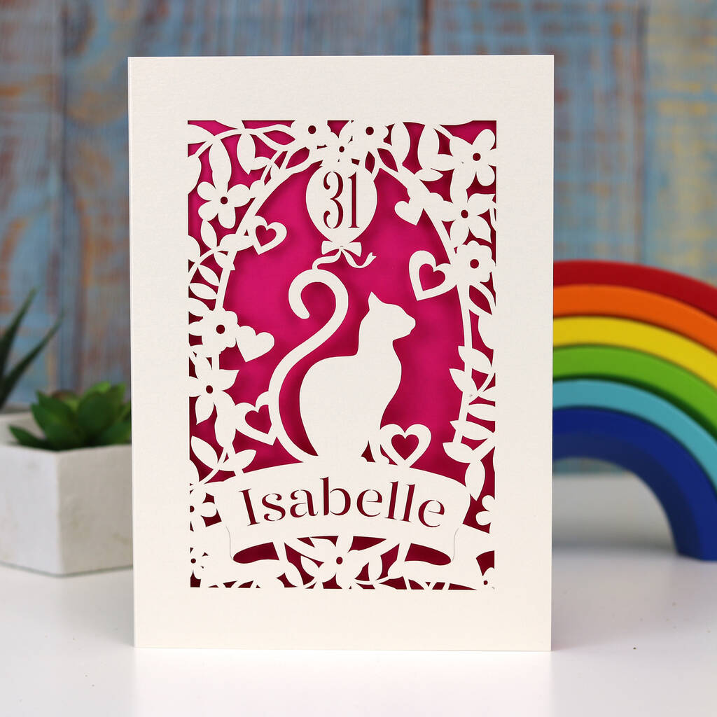 Gorgeous papercut birthday card featuring a cat and a balloon. Can be personalised with age and name. Laser cut from cream card with a shocking pink insert paper.