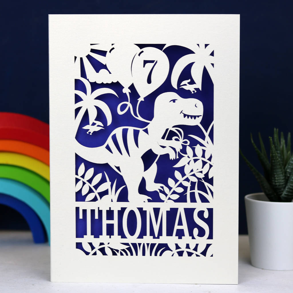 A cream and violet birthday card for son. Personalised cards feature a dinosaur holding a balloon