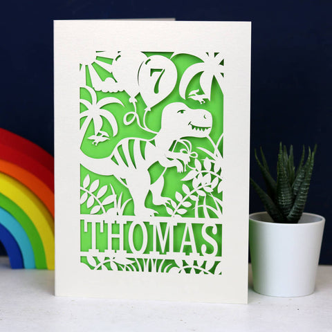 A cream and green birthday card for a grandson. Features a dinosaur, name and age.  - A5 (large) / Bright Green