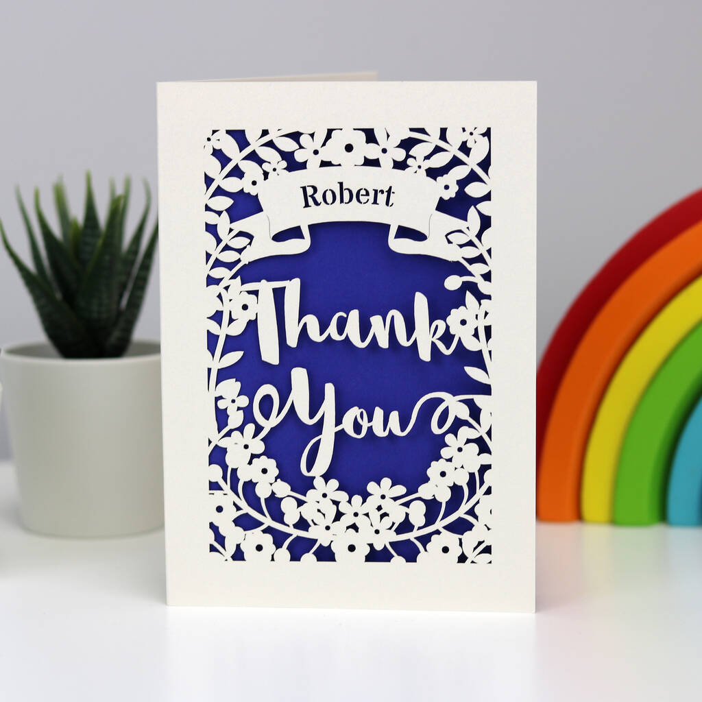 Laser cut Thank You card in cream and infra violet.  Personalised in a banner with Thank you in large letters surrounded with flowers.