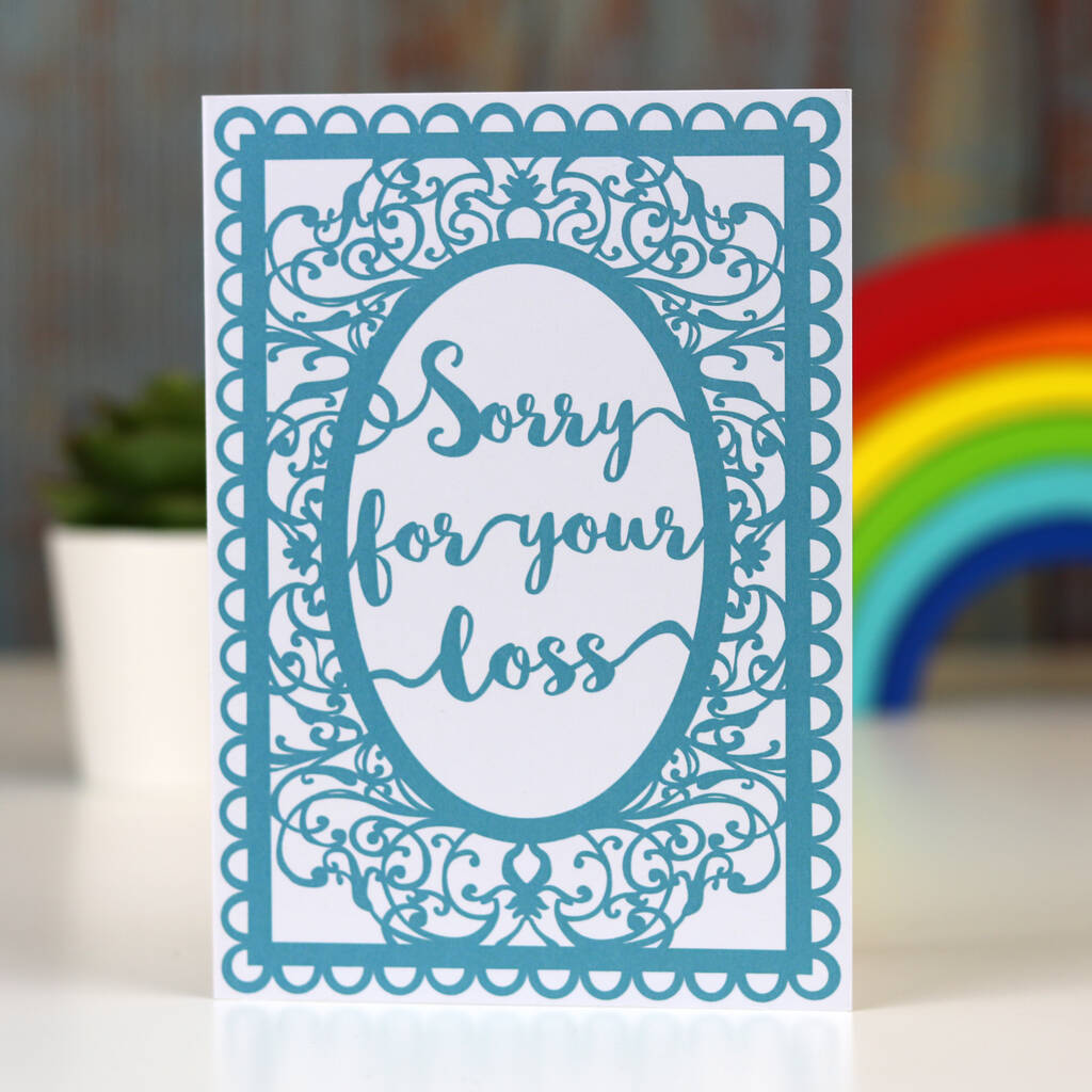 A sympathy card with a blue ornate border and the text 'Sorry for your loss' displayed in a cursive font inside a oval shape.