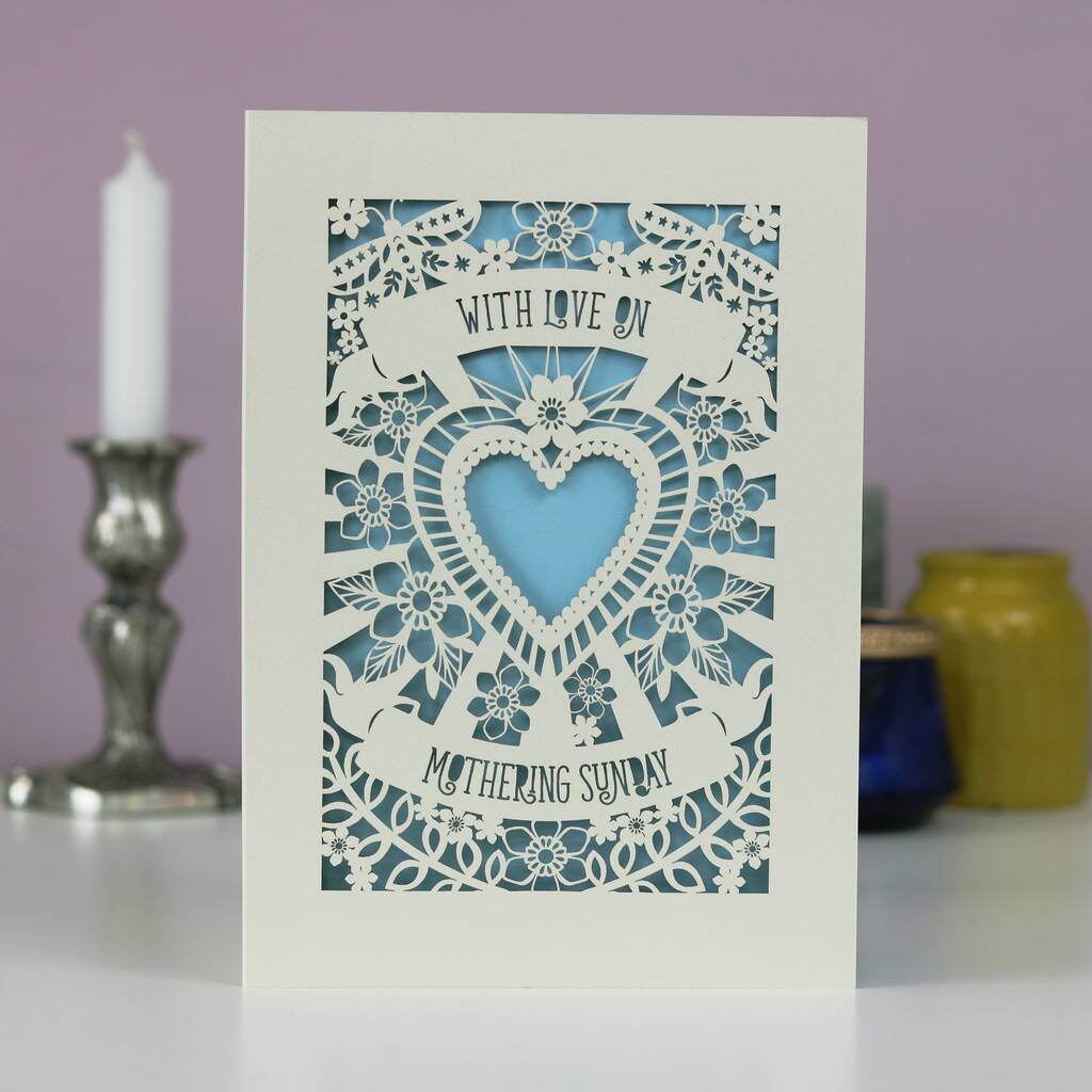 A cream cut out Mother's Day card that says "With love on Mothering Sunday"